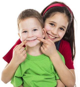Two children smiling about the visit to their dentist in Wasilla, AK.